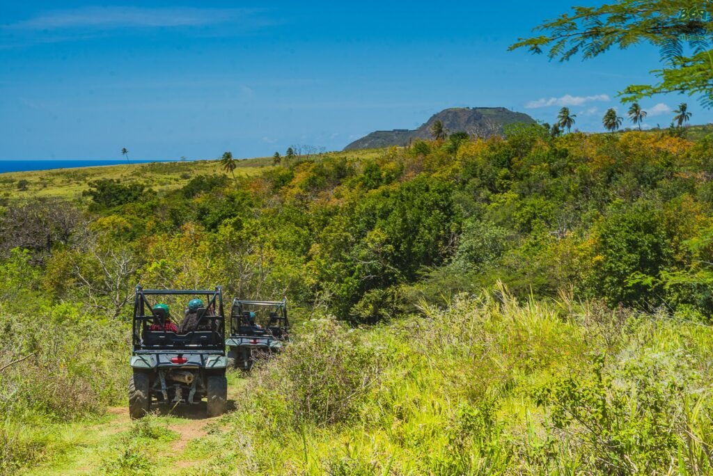 A 869ATVentures side by side convoy on the estate trail with Brimstone Hill Fortress on the hill behind, St. Kitts